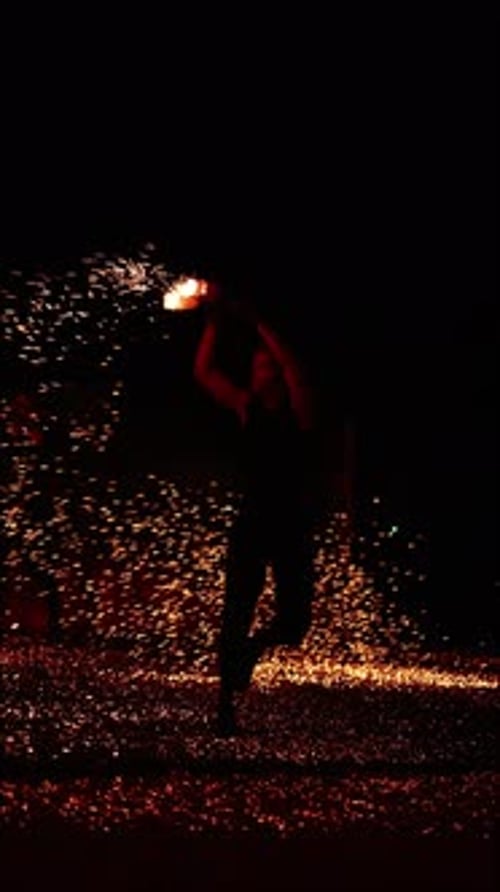 Fire Show Man with Fiery Sparks in His Hands in the Maldives Vertical Footage