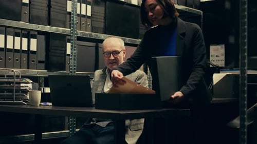 Teamwork in Office Setting Reviewing Documents