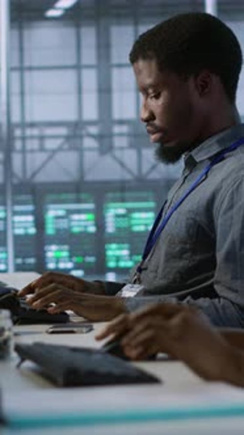 Vertical Video Data Center Engineers Maintaining Company Network Infrastructure