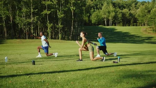 Athletic Adults Exercising Outdoors in a Group