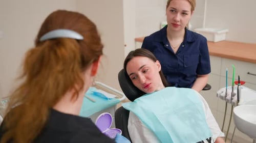 Female Dentist Talks About Caring Teeth Braces Patient in Dental Office