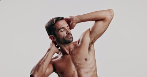 Man, pride and flexing biceps in studio with strong muscles, masculinity and bodybuilding progress