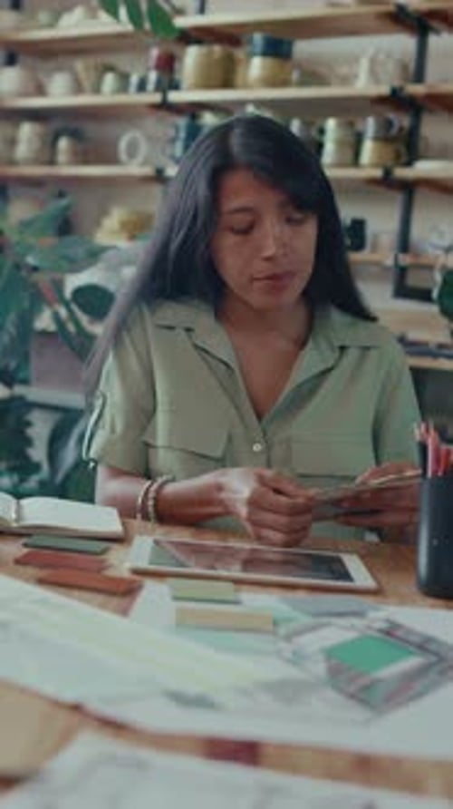 Portrait of Positive Woman Posing for Camera Working with Colour Palette