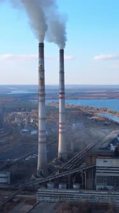 Atmospheric air pollution from industrial smoke. Pipes with chemical smoke from industrial plant.