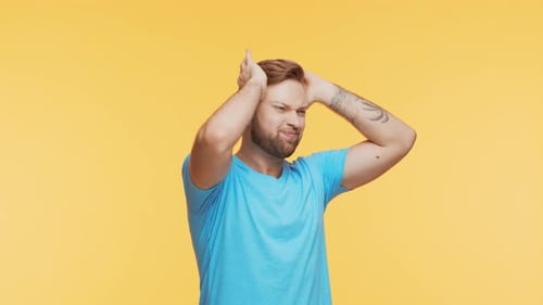 Expressive Young Man Having Pain Over Vibrant Background Studio Portrait of Handsome Person