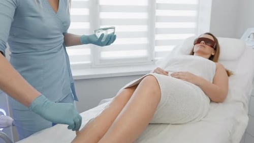 Woman Receiving Laser Hair Removal Treatment at Medical Spa