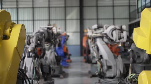 Engineer work at robotic arm factory.