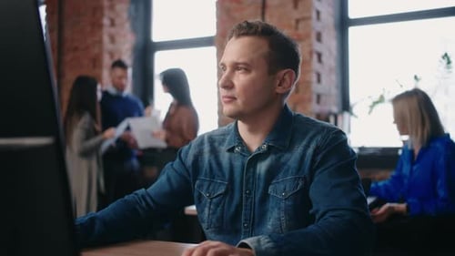 Diverse People Work In Loft Office Portrait Of MiddleAged Man At Computer Engineer Or Web Designer
