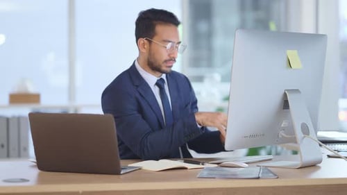 Financial trader typing on computer keyboard, thinking and investing in stock trade
