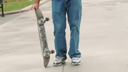 Young Skater Making 360 Flip Jump Performing Kickflip Trick Skateboarder Training in Skatepark