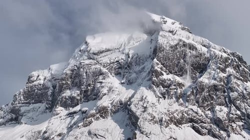 The winter landscape captures the panoramic view of Fronalpstock, a majestic peak within the Glarus