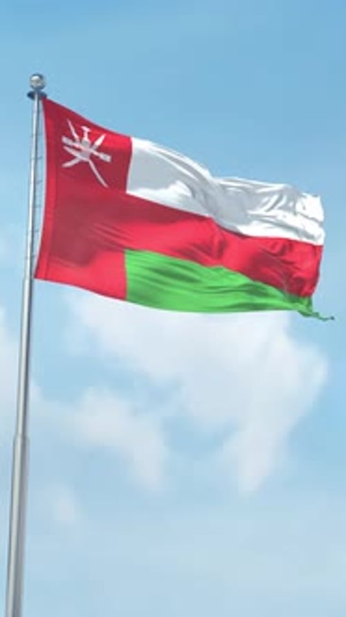 Oman National Flag Waving in the Wind with Blue Sky