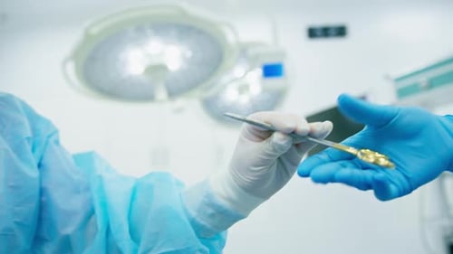 Surgical Instrument Exchange in Bright Hospital Operating Room