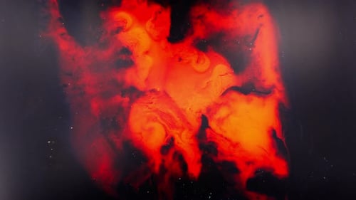 view of vibrant alcohol ink swirling in red and black abstract composition