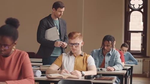 College Professor Helping Student during Exam