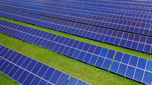 Solar cell panels field. Blue solar panels farm for clean energy.
