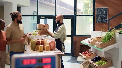 Worker Helping Customers in Local Grocery Store
