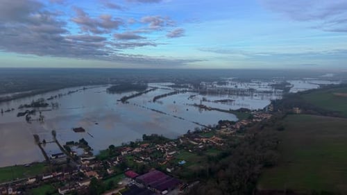 Aerial view of waterlogged fields reflecting the sky, Langoiran, France.