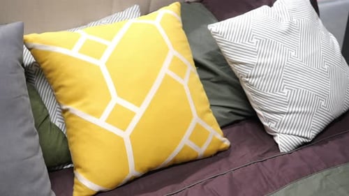 Stylish Cushions Arranged on a Bed
