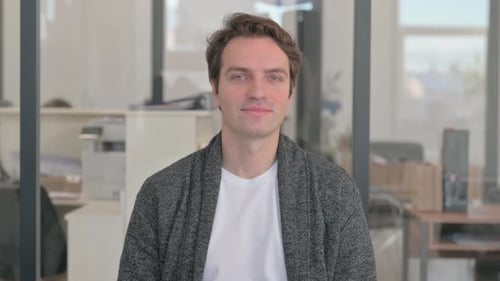 Young Adult Man Giving Thumbs Up Approval