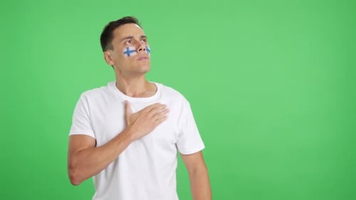 Man Listening to the Finland National Anthem with Solemnity