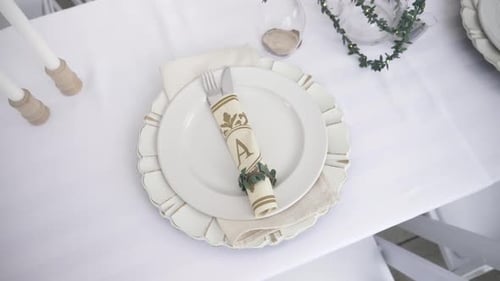Elegant Wedding Table Setting with White Plates