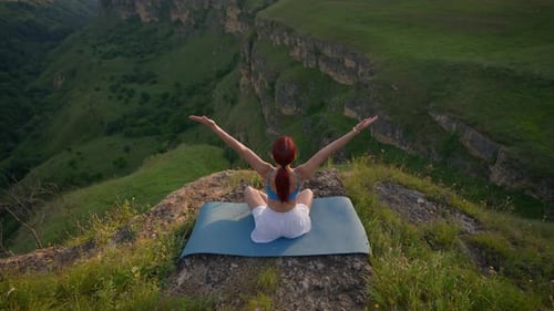 Athletic Woman Doing Yoga Poses on Top Mountain During Sunset Healthy Lifestyle