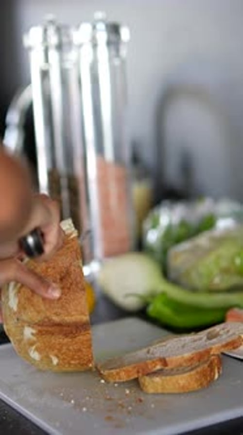 Slicing Bread Loaf in the Kitchen