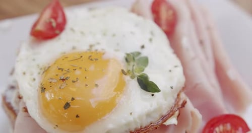 Delicious Breakfast Plate with Fried Egg, Ham, and Toast