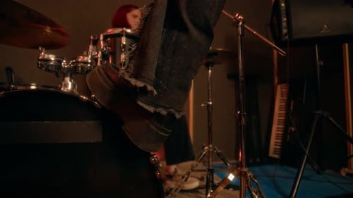 Singer in Punk Rock Band Putting her Shoe on Bass Drum, Singing in Music Studio