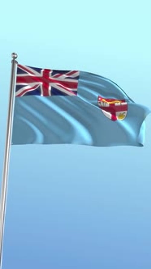 Fiji Flag Waving on Flagpole Against Blue Sky Loop