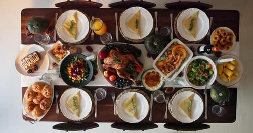 Top view, thanksgiving and food for dinner on table with plate layout, vegetables