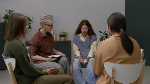 Women Sitting in Circle During Support Group Meeting