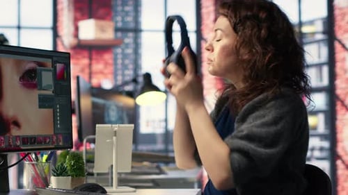 Woman Working at Computer in Modern Office