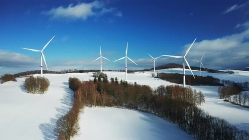 Aerial View of Wind Turbine Farm on the Hill in Winter Sunny Day