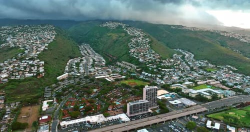 Numerous houses situated on the green rocks and among them.