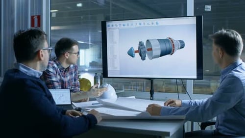 Team of Industrial Engineers Discuss 3D Model of Turbine/ Engine Design Shown on a Presentation Dis