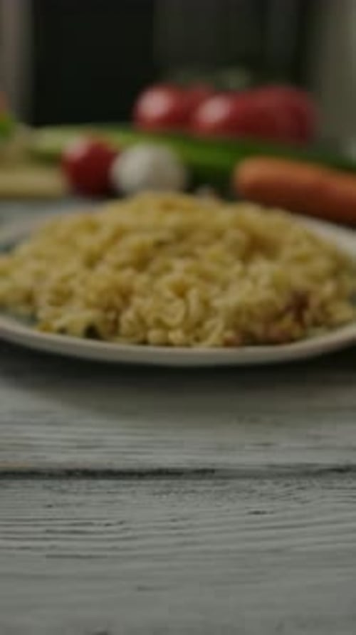 Vertical of Portion of Noodles Amidst Assorted Vegetables Dolly in