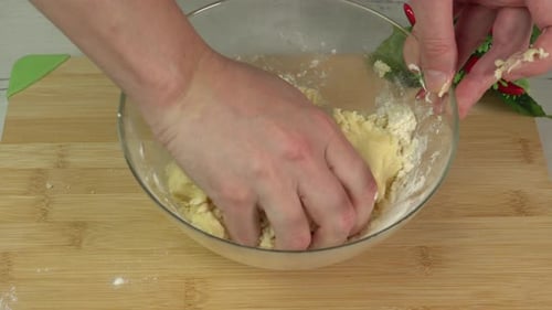 Preparing Dough in Bowl on Wooden Board