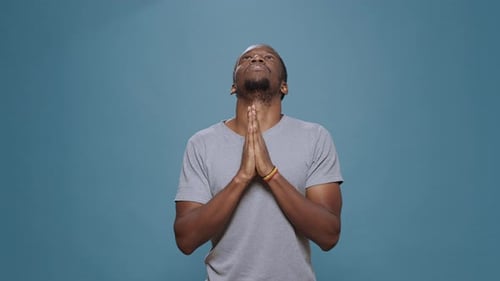 Male Model Holding Hands in Prayer to Do Spiritual Session