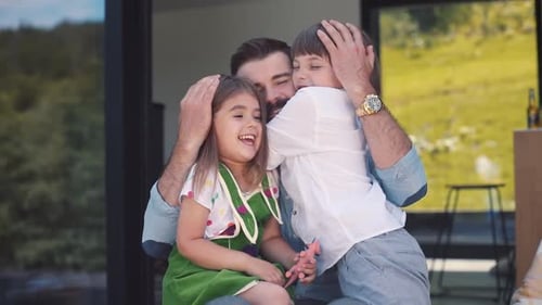Cheerful Handsome Caucasian Dad Hugging Playing with Children Daughter and Son Having Fun with