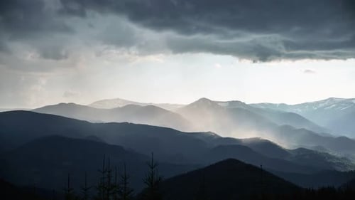 Dramatic Sunlight over Mountain Ranges After Storm