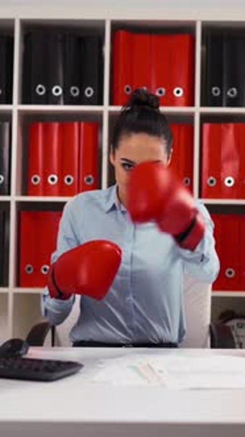 Vertical of Young Businesswoman in Boxing Concept