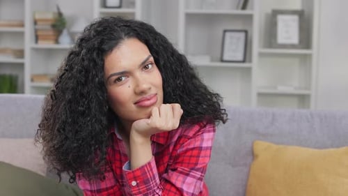 Smiling Woman with Curly Hair Indoors
