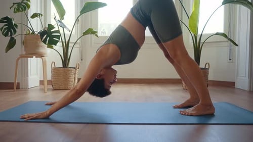 Woman Doing Yoga in Her Living Room