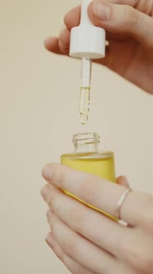 Dropping Liquid from a Small Cosmetic Bottle