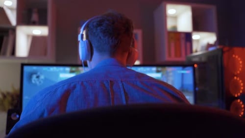 Young Adult Gaming at Home at Night