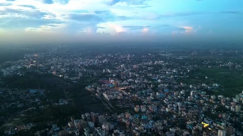 An aerial view of the city from above, showcasing the intricate layout of buildings, roads, and gree