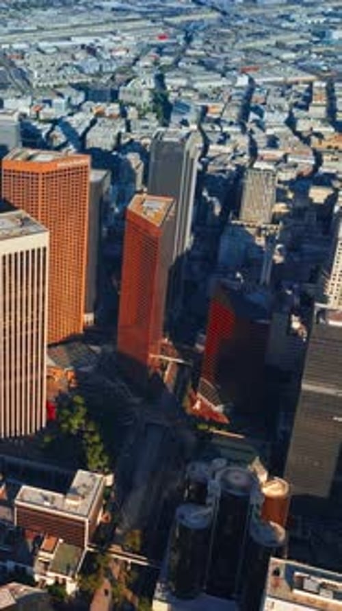 Sunlit skyscrapers dropping shadows on the city panorama. Amazing Los Angeles diverse architecture
