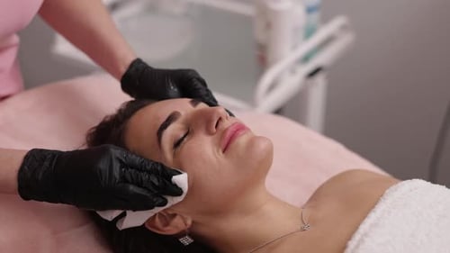 Woman Receives Facial Treatment at a Beauty Spa